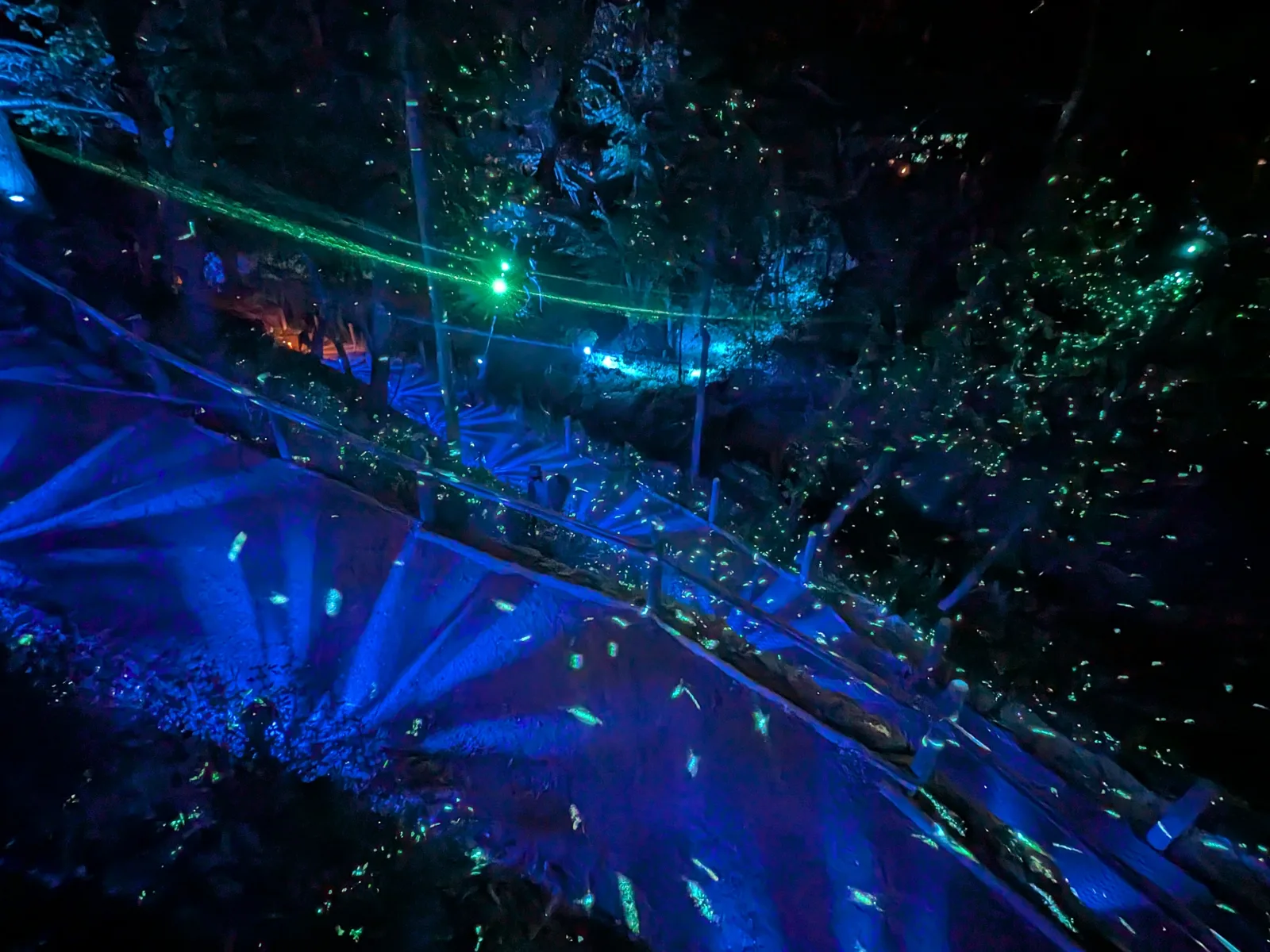 A boardwalk lit in blue at Aquavia Lumina