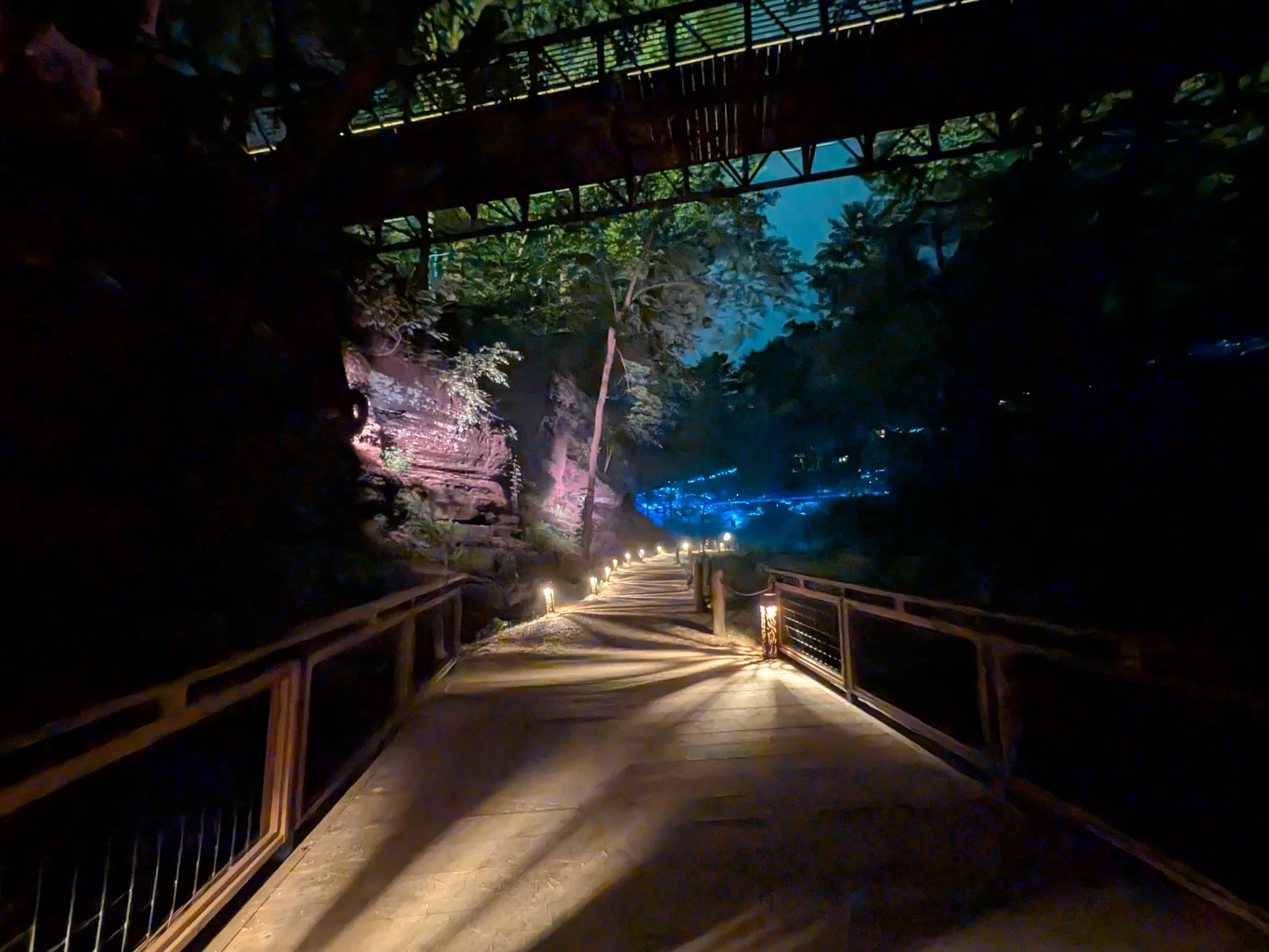 The canyon boardwalk lit at night at Aquavia Lumina