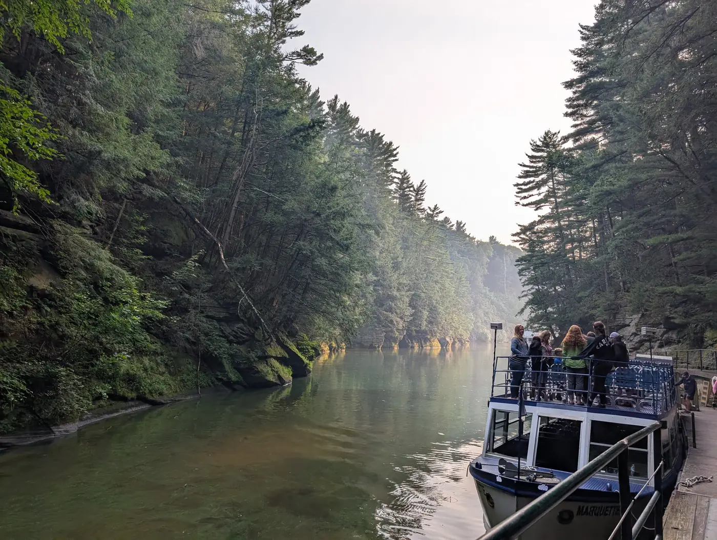 A tour boat docked at the entrance to Witches Gulch