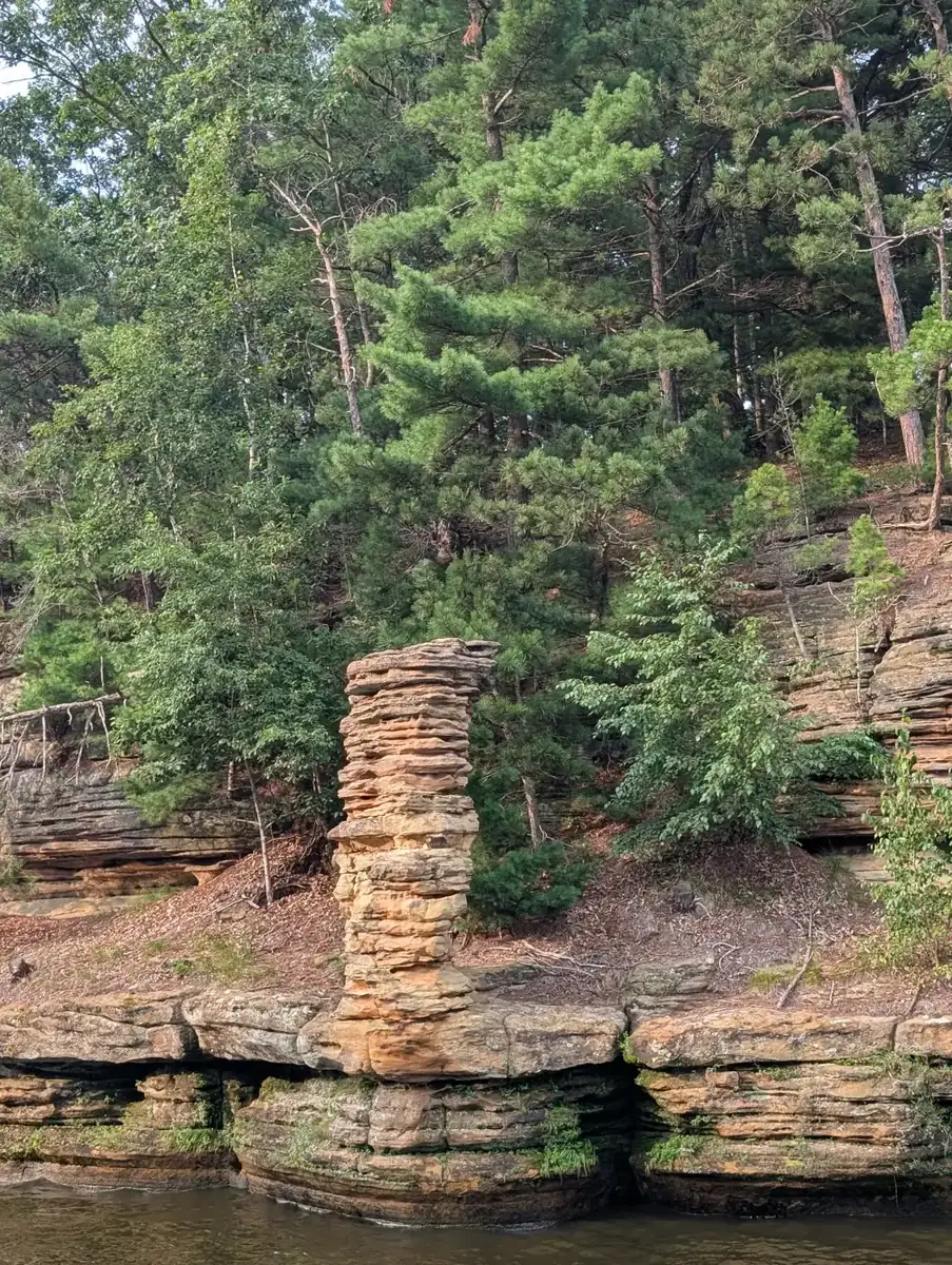 A sandstone pillar on the riverbank of the Upper Dells