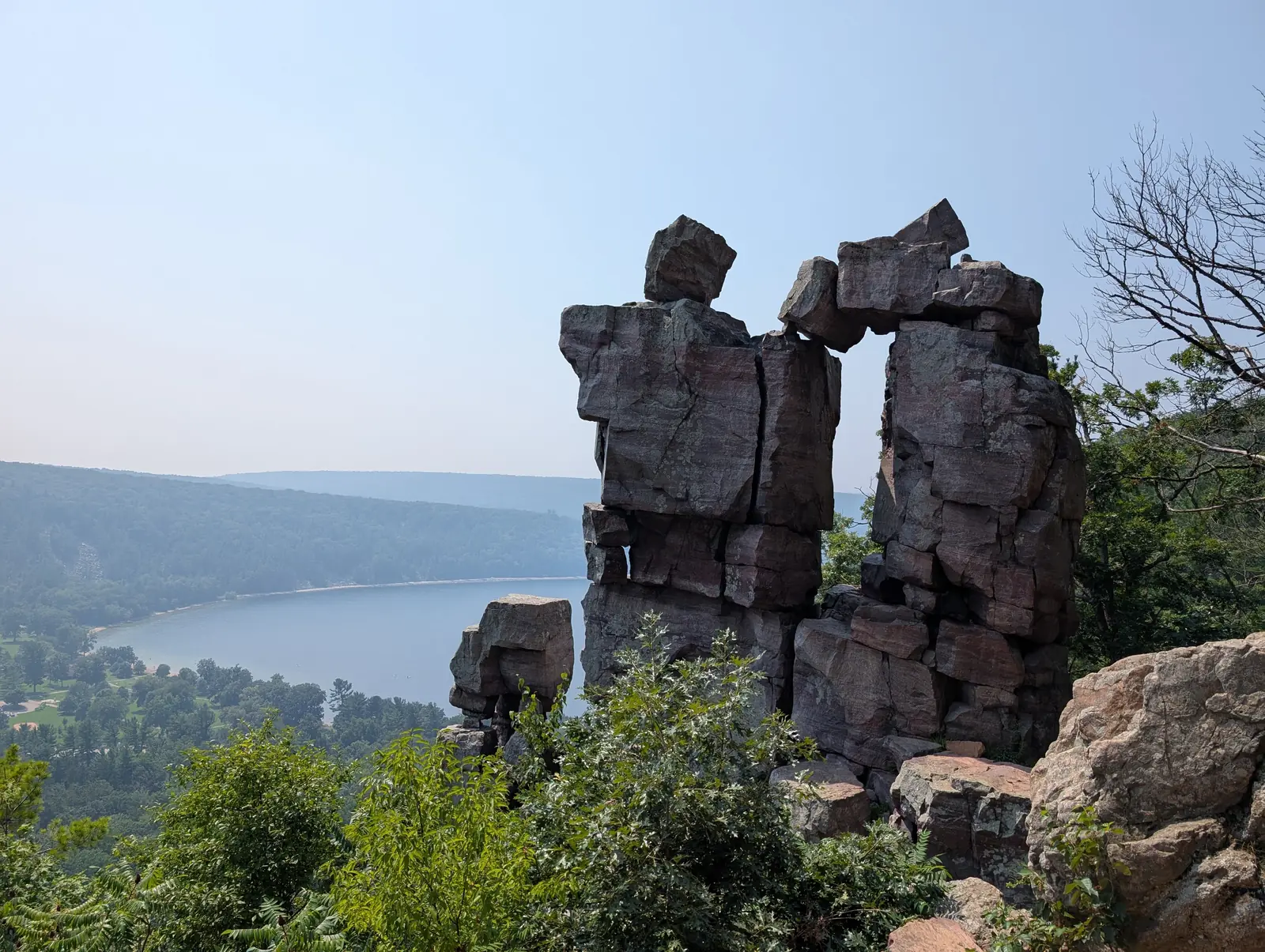 Devil's Doorway, a quartzite rock formation on the East Bluff, with Devil's Lake below