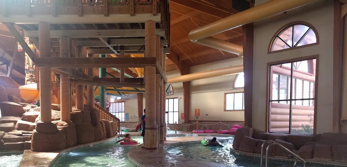 The Crooked Creek lazy river winding under the slide towers at Great Wolf Lodge