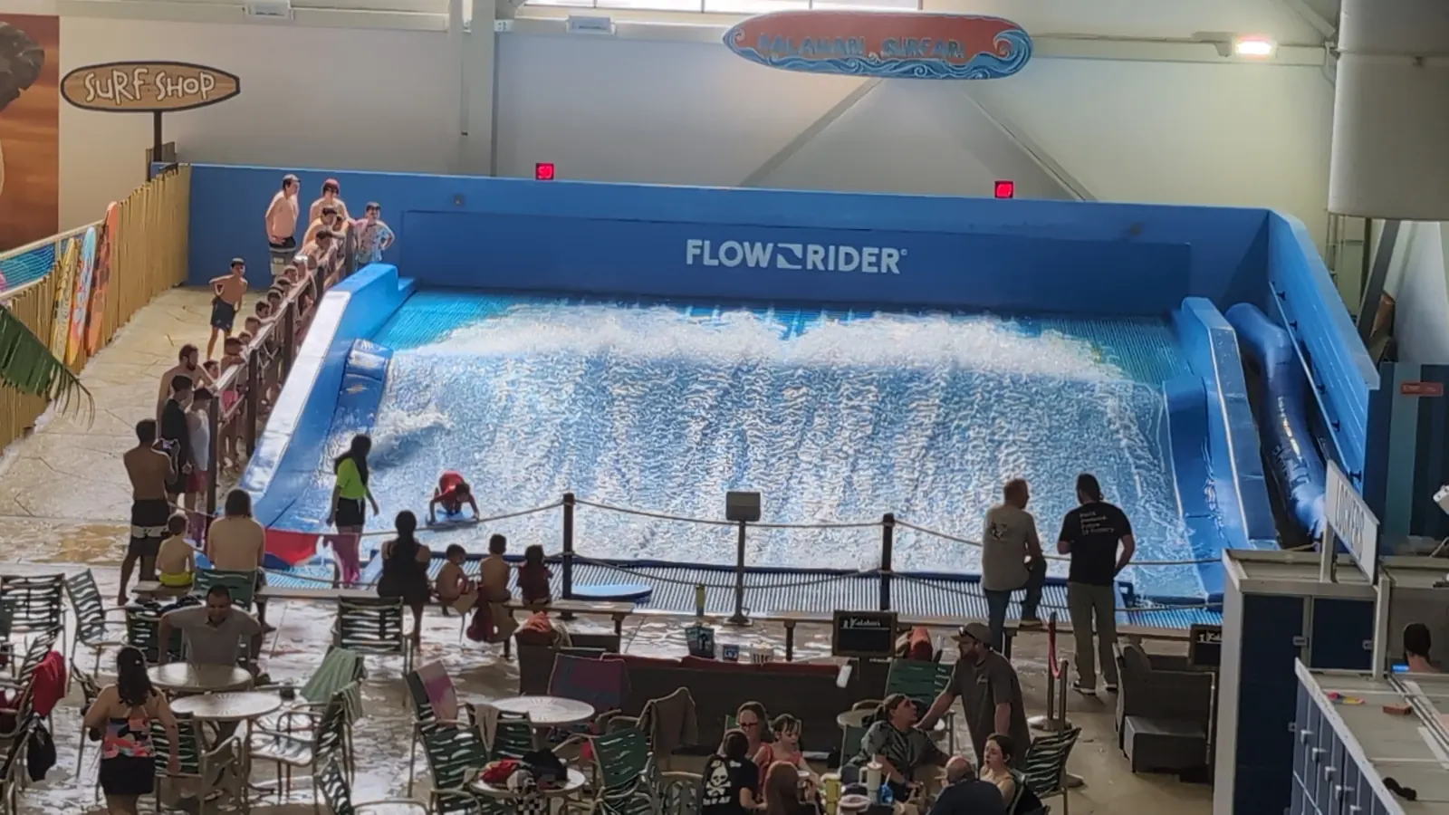 Riders on the FlowRider surf simulator at Kalahari