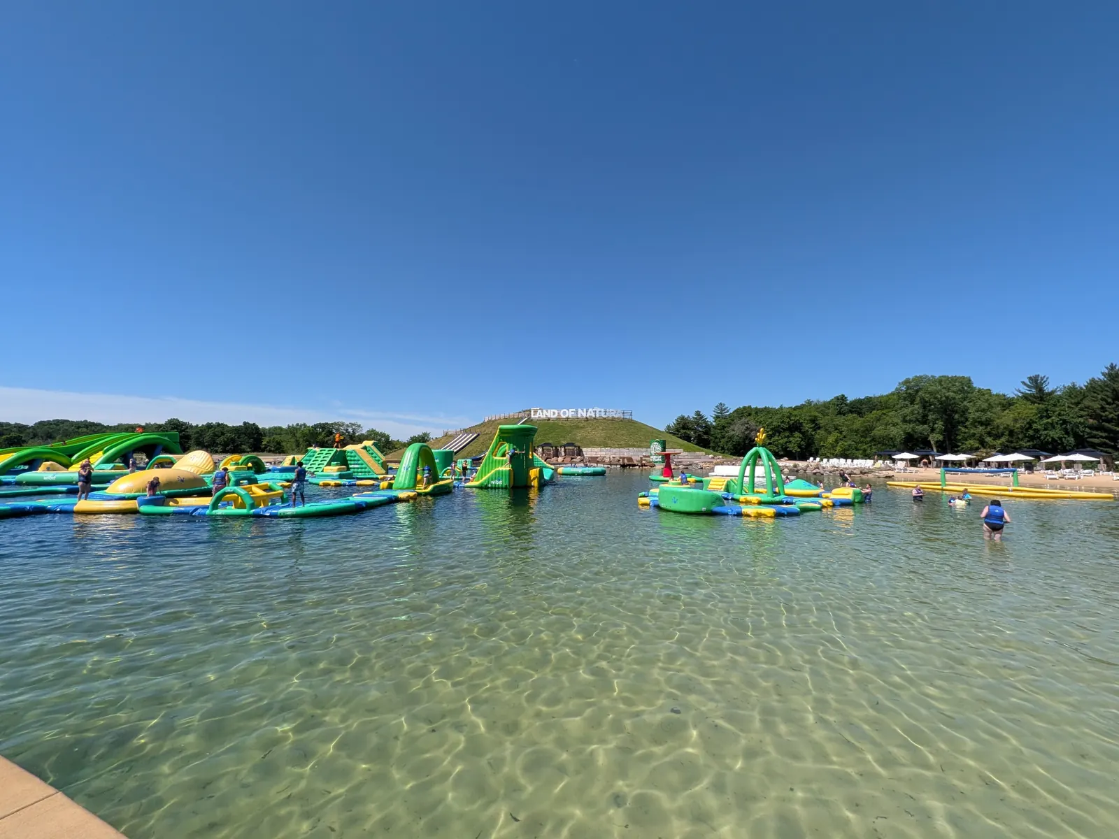 Clear, shallow water at the edge of the lake at Land of Natura