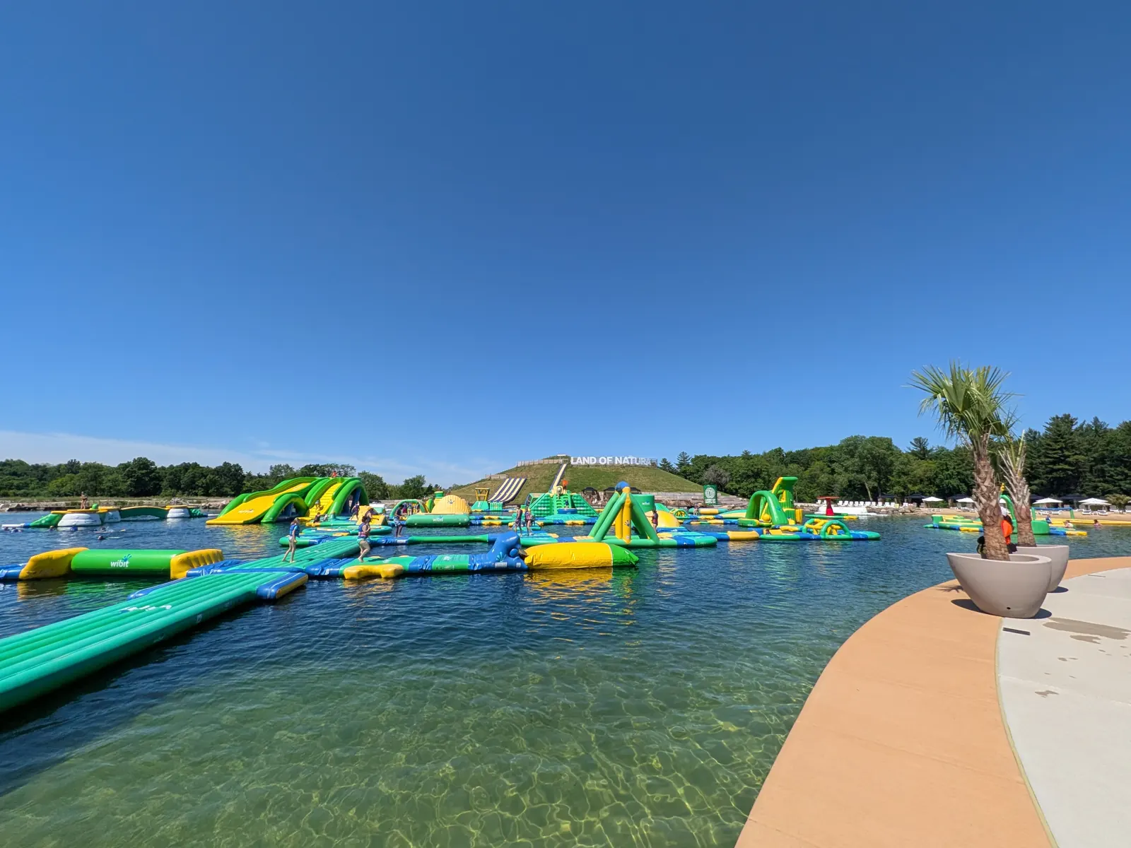 The floating inflatable waterpark on the lake at Land of Natura in Wisconsin Dells