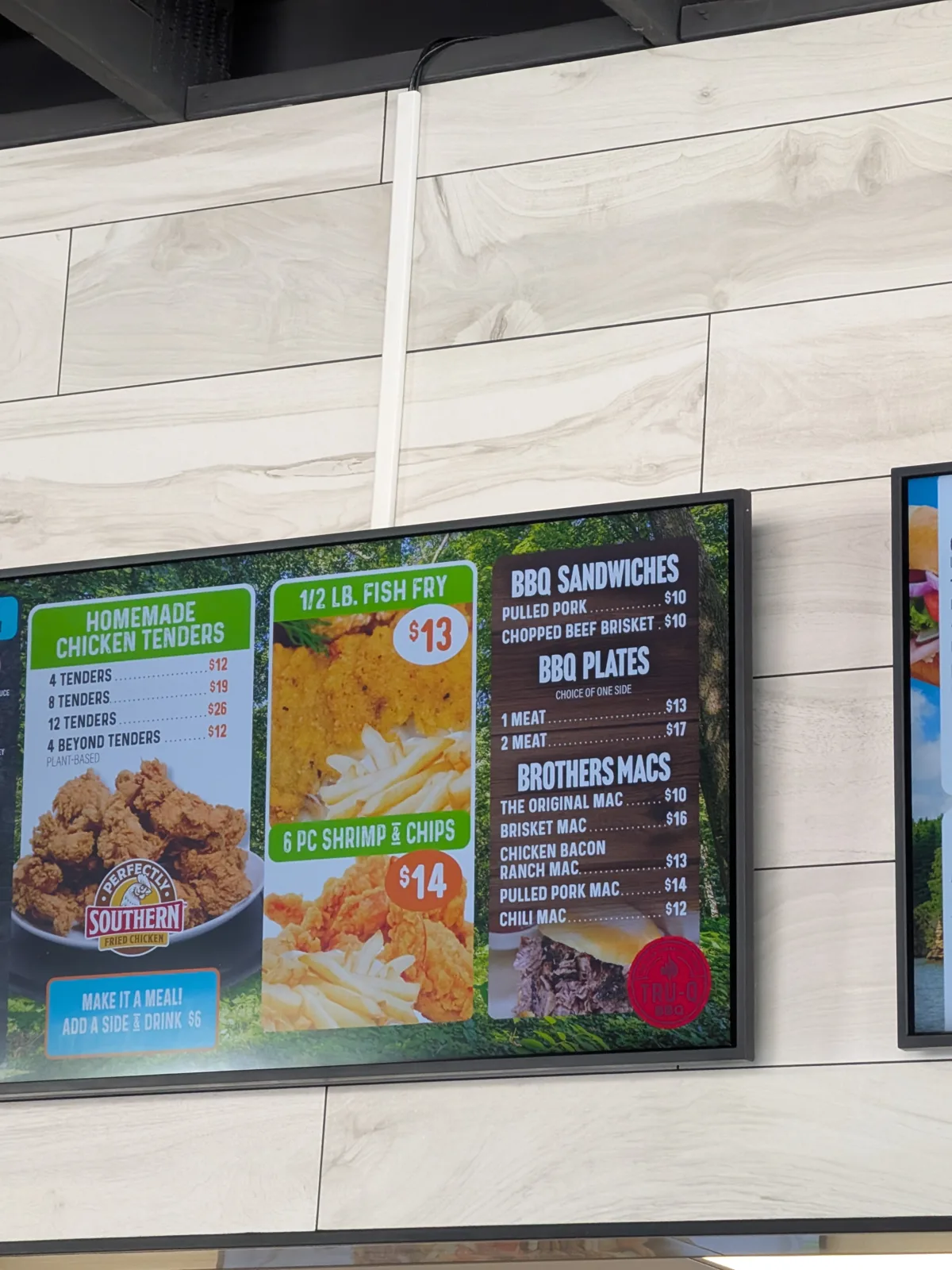 The menu board at the Land of Natura snack counter