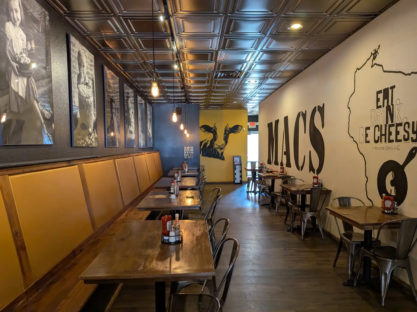 The dining room at MACS with booths and wood tables