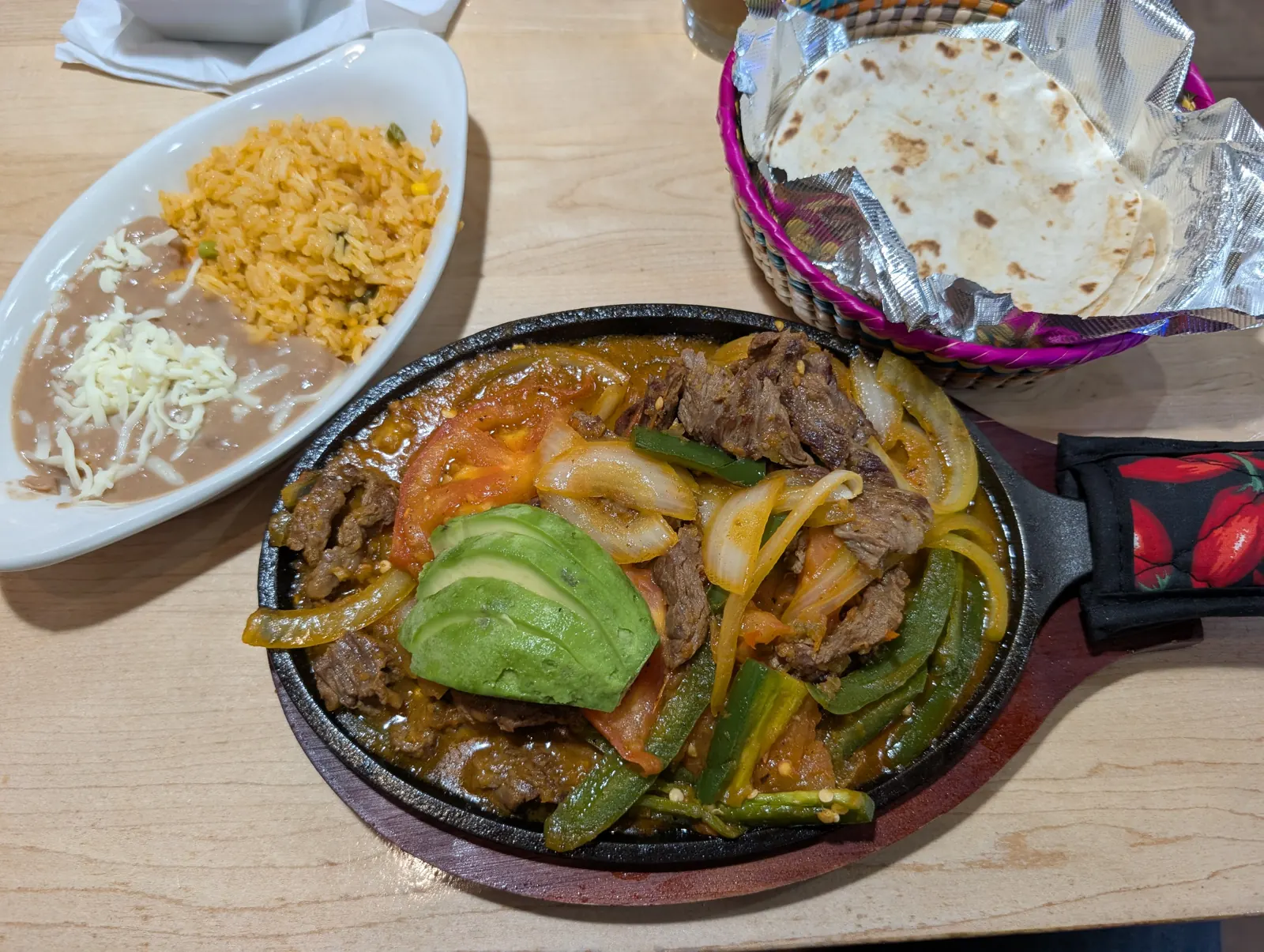 Bistec a la Mexicana on a sizzling skillet with rice, beans and tortillas at MarAzul, Wisconsin Dells
