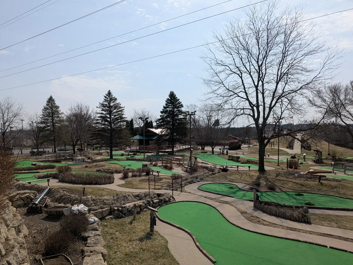 Mini golf greens winding over a hillside at Pirate's Cove Adventure Golf in Wisconsin Dells
