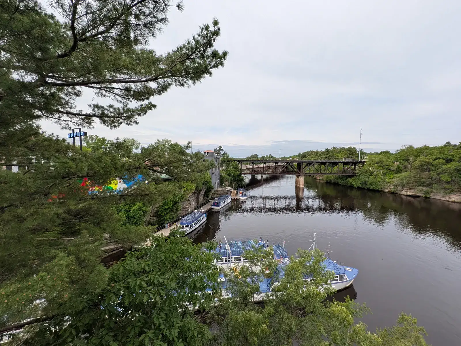 Tour boats docked on the Wisconsin River, seen from the River Walk