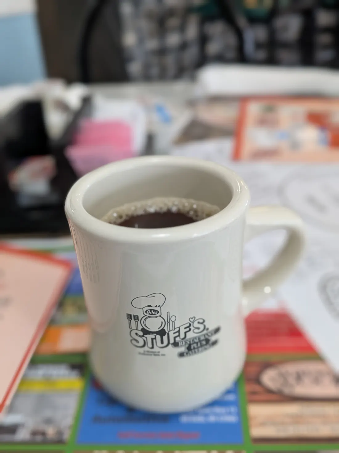 A Stuff's coffee mug on the table