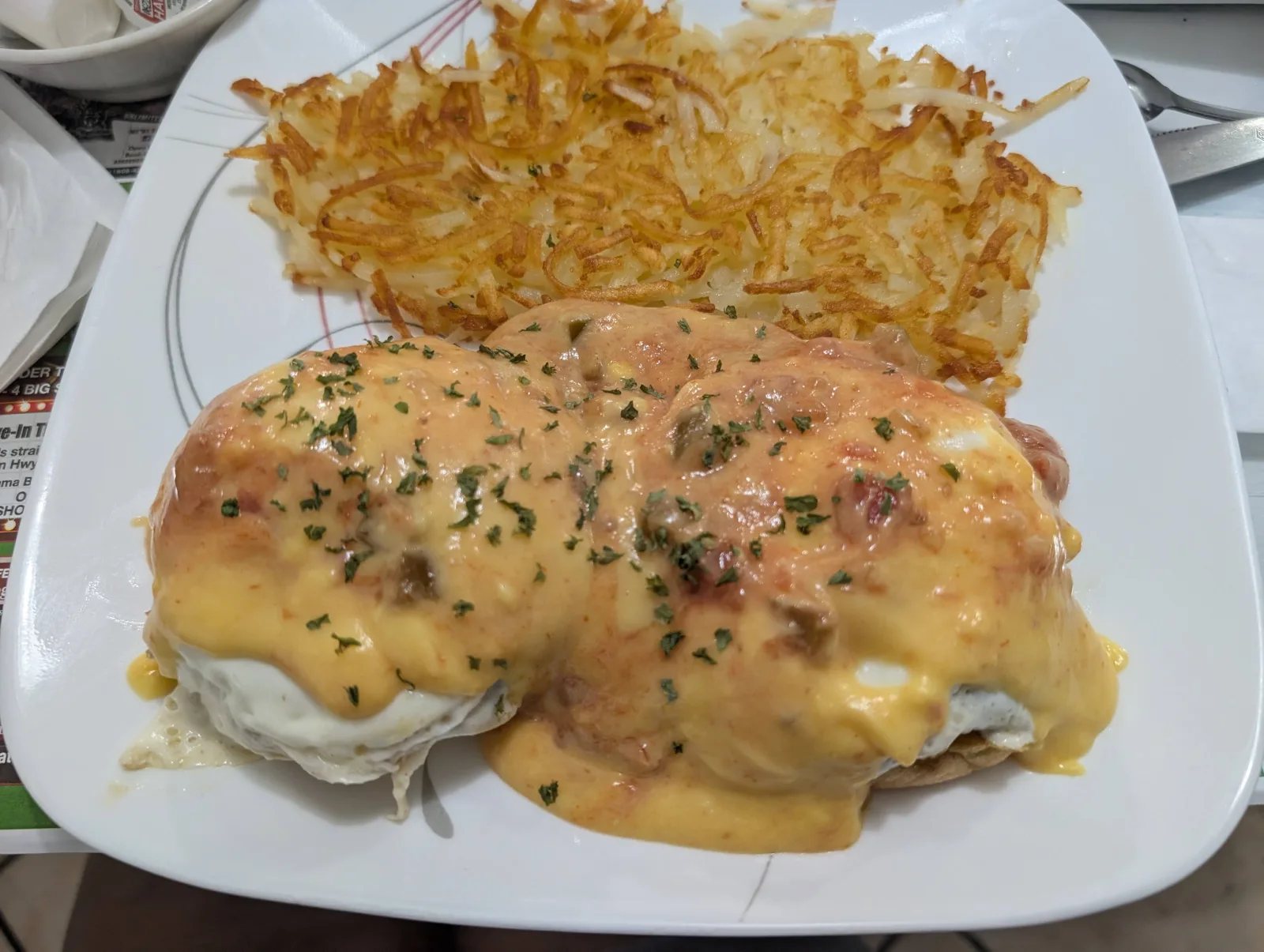 Eggs Benedict with crispy hash browns at Stuff's