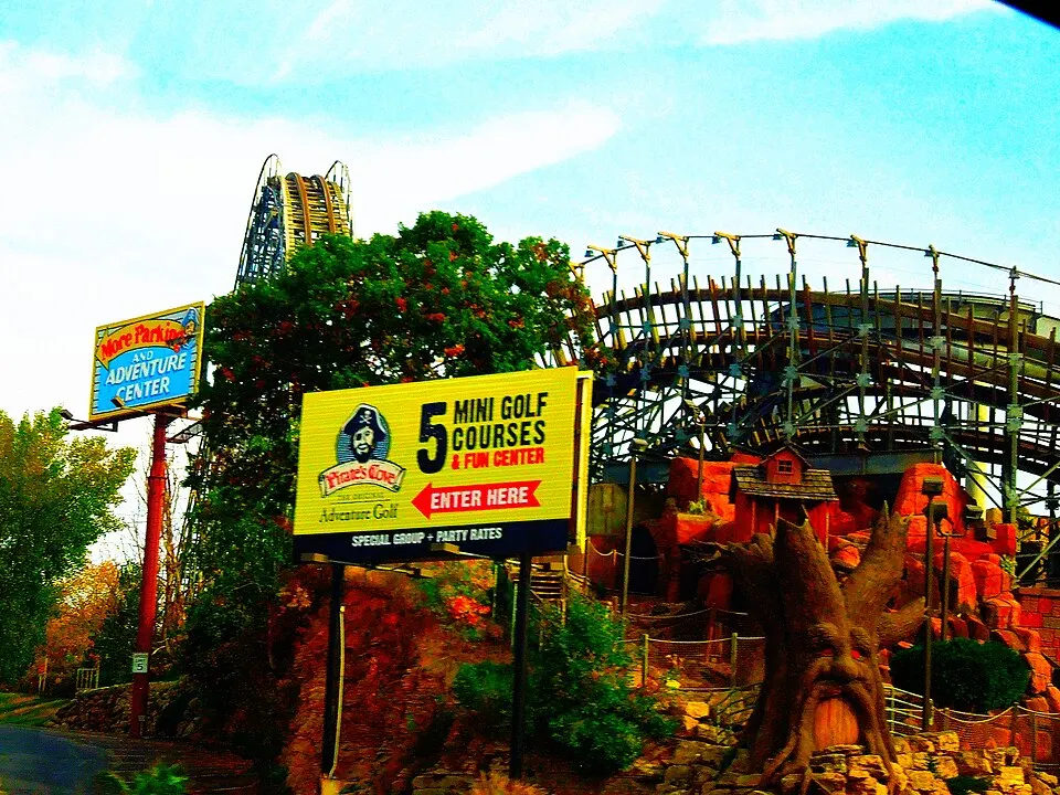 Timber Falls Adventure Park sign and roller coaster