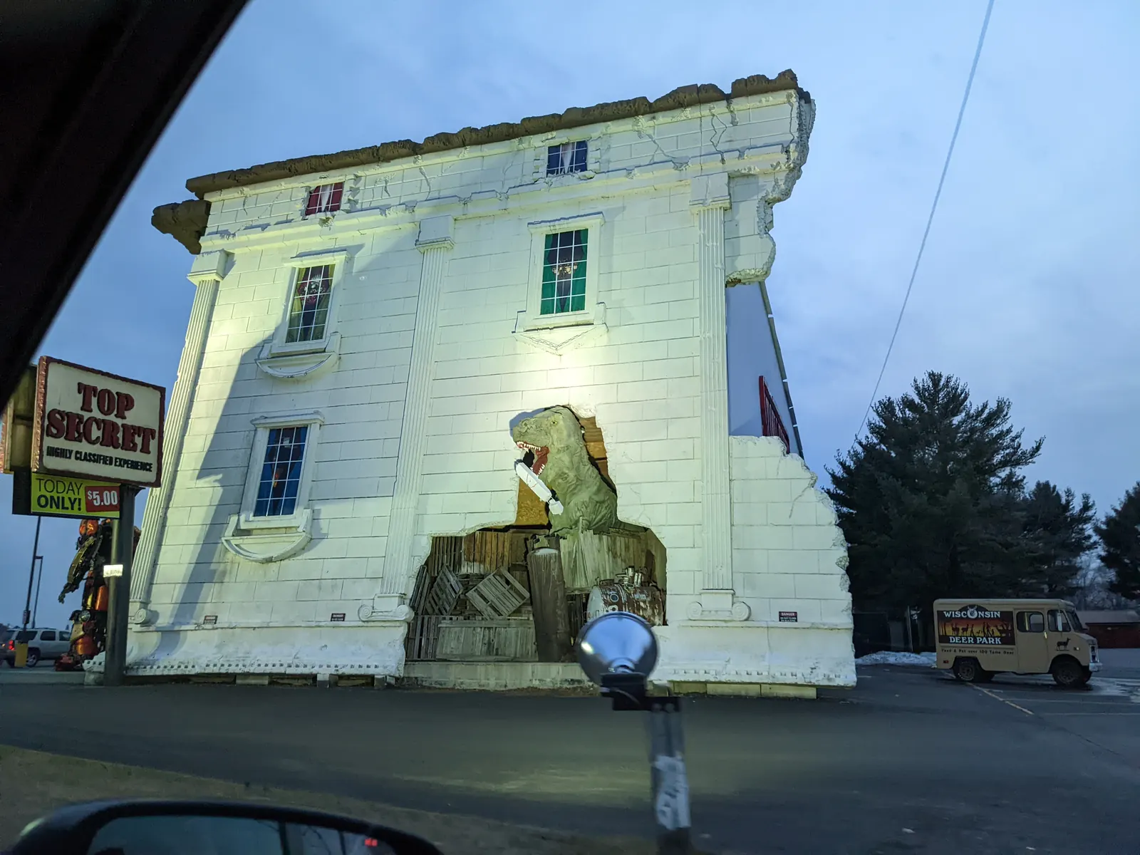 The upside-down White House at Top Secret, lit up at dusk
