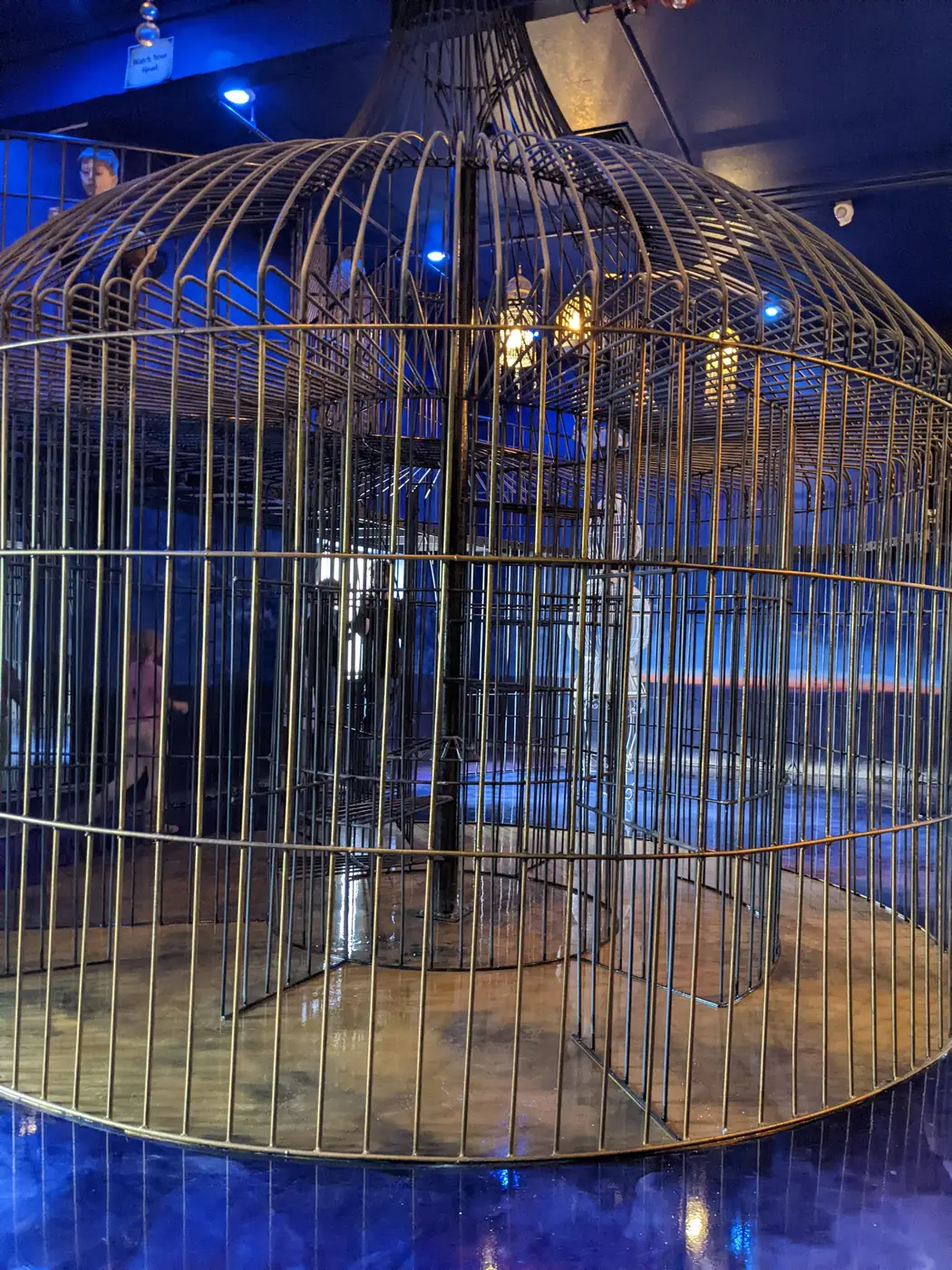 A giant birdcage set inside Wizard Quest